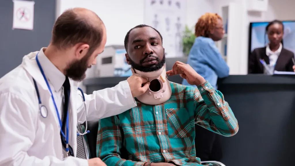 A car accident doctor consulting with a patient following an auto injury.