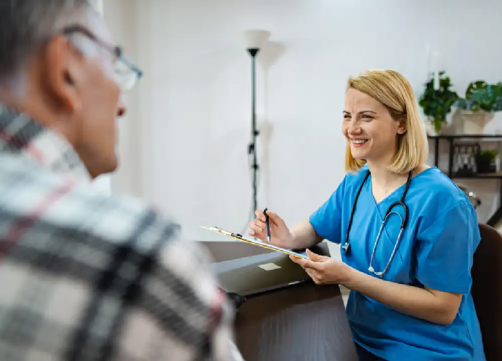 A doctor and patient having a consultation in a medical office.